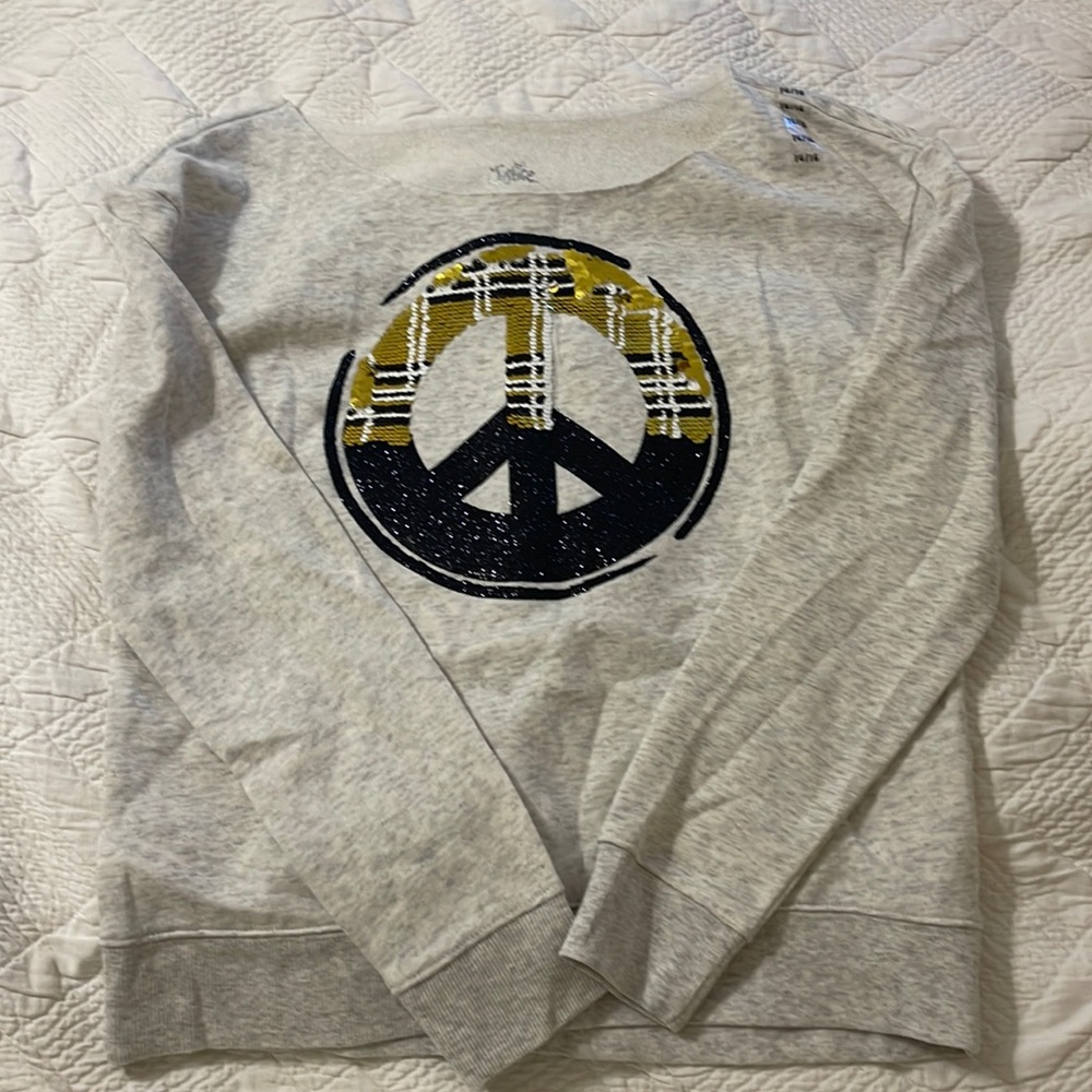New justice sweatshirt size 14/16 peace